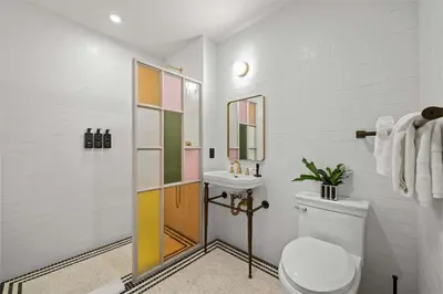 a bathroom with a toilet and a sink at Freeman 203 by Rove Travel -1BR Condo with Shared Amenities in New York
