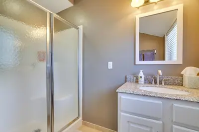 a bathroom with a shower and a sink at Steps to Lake Tanglwood Tranquil Wooded Retreat in Greentown