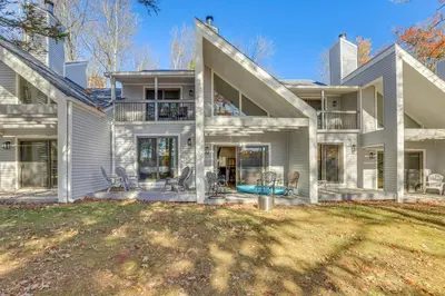 a large white house with a yard at Steps to Lake Tanglwood Tranquil Wooded Retreat in Greentown