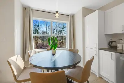 a kitchen with a table and chairs and a window at Spacious 5BR Home KING Bed Wi-Fi Parking in Bloomfield