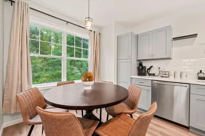 a kitchen with a table and chairs and a window at Old, Unlisted in Bloomfield