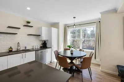 a kitchen and dining room with a table and chairs at Old, Unlisted in Bloomfield