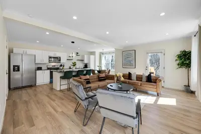 a living room with a couch and a table at Old, Unlisted in Bloomfield
