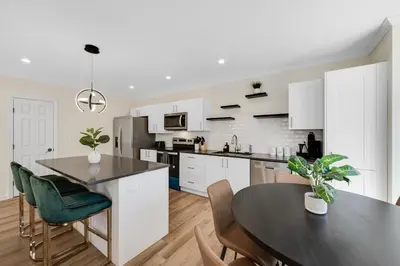 a kitchen and dining room with a table and chairs at Old, Unlisted in Bloomfield