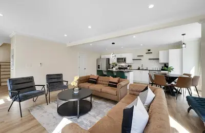a living room with a couch and a table at Elegant 2 Story Bloomfield 3 Kings 2 Queens in Bloomfield