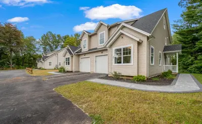 a large house with a driveway at Elegant 2 Story Bloomfield 3 Kings 2 Queens in Bloomfield