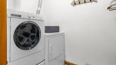 a washer and dryer in a white room at Discounted Winter Rates Ski Retreat Hot Tub Fire Pit Windham Mountain House in Windham