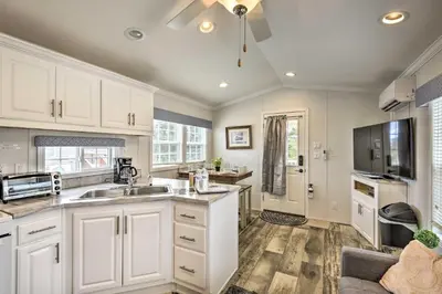 a kitchen with white cabinets and a sink at Cottage and Suite Close to Camps and Ski Resorts in Pleasant Mount