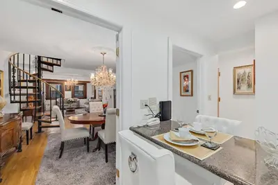 a kitchen and living room with a dining room at Harlem Gem in New York