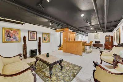 a living room with a couch and a table at Harlem Gem in New York