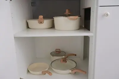 a shelf with three bowls and a sink in a kitchen at Cozy Home, 19m to NYC, 10m to American Dream in Wallington