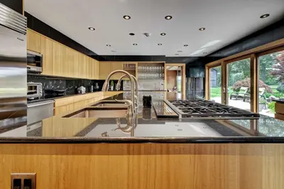 a large kitchen with a sink and a stove at Longpond House in Salisbury