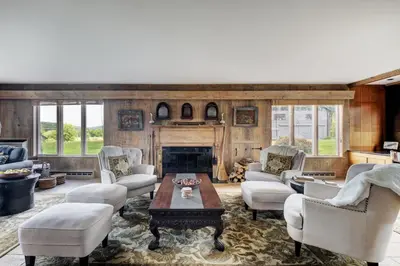 a living room filled with furniture and a fireplace at Longpond House in Salisbury
