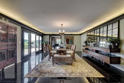 a living room with a couch and chairs and windows at Longpond House in Salisbury