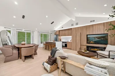a living room with a couch and a fireplace at Pond House at Carter Bridge Estate in Freehold