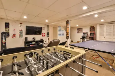 a ping pong room with a ping pong table and a ping pong at Hot Tub Pool & Pond - Catskills Family Escape in Cairo