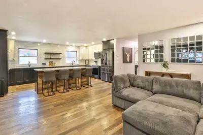 a living room with a couch and a kitchen at Hot Tub Pool & Pond - Catskills Family Escape in Cairo