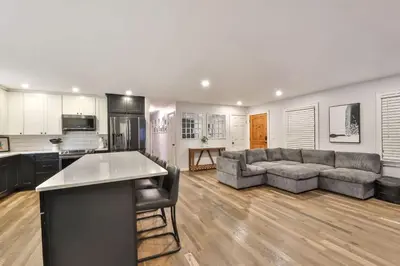 a large living room with a couch and a kitchen at Hot Tub Pool & Pond - Catskills Family Escape in Cairo