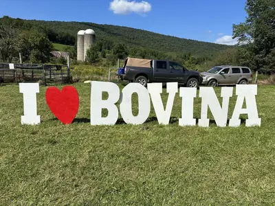 a sign that says i love bowling in a field at The Mountain Brook Inn in Bovina Center