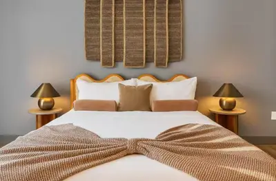 a bedroom with a large bed with a bow tie on it at Hartford New 1BR near XL Center and Convention in Hartford