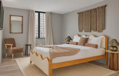 a bedroom with a large bed and a chair at Hartford New 1BR near XL Center and Convention in Hartford