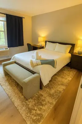 a large bedroom with a large bed and a couch at Modern 2BR Westville Downtown Near Yale Wifi in New Haven
