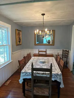 a dining room with a table and a mirror at New Leeds listing Near Graces diner and Hudson! in Catskill