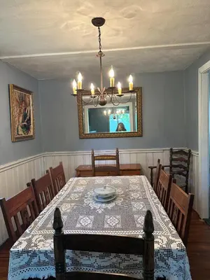 a dining room with a table and a mirror at New Leeds listing Near Graces diner and Hudson! in Catskill
