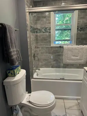 a bathroom with a toilet and a tub and a sink at New Leeds listing Near Graces diner and Hudson! in Catskill