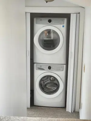 a washing machine and a washer in a room at Romantic Retreat with a Jacuzzi 