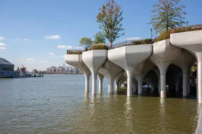 a building in the water next to a body of water at Blueground Chelsea fitness center nr Madison Square Park NYC-390 in New York