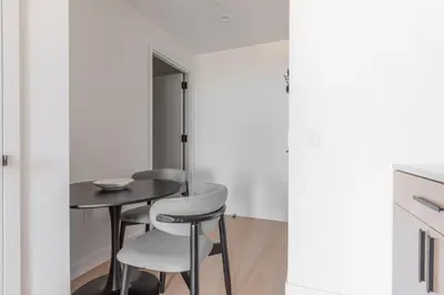 a dining room with a table and two chairs at Blueground Southside doorman nr Brooklyn Bridge NYC-2132 in Brooklyn