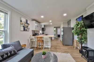 a living room with a couch and a kitchen at Group Getaway 1 Mile From Hunter Mtn with Fire Pit in Hunter