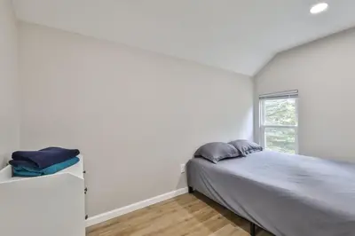 a bedroom with a bed and a window at Group Getaway 1 Mile From Hunter Mtn with Fire Pit in Hunter