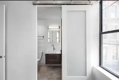 a bathroom with a toilet and a sink and a window at Residence Heritage Terrace Dreaming in New York
