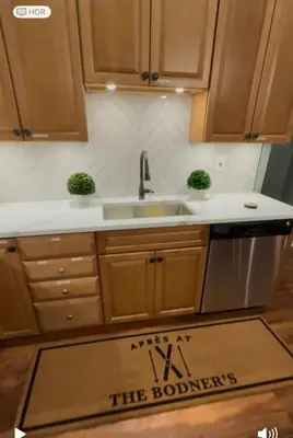 a kitchen with a sink and a counter top at Modern Hunter Mountain Condo Steps from Slopes in Hunter