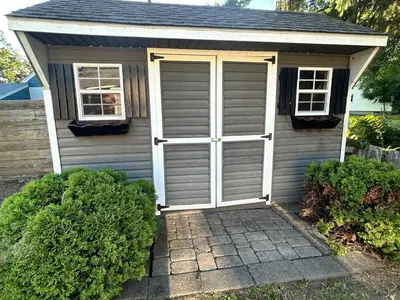 a garage with a pair of doors on it at Litchfield Retreat, Wineries, Foliage & Skiing in Torrington