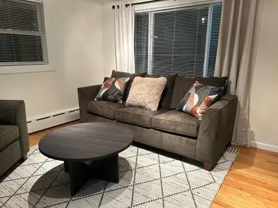 a living room with a couch and a coffee table at Litchfield Retreat, Wineries, Foliage & Skiing in Torrington