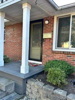 a front porch of a brick house with a green door at Litchfield Retreat, Wineries, Foliage & Skiing in Torrington