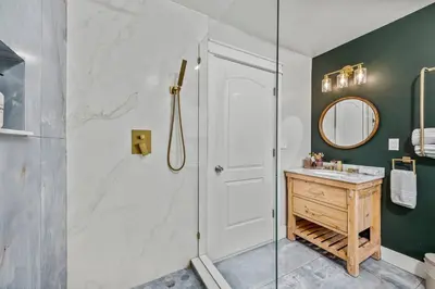 a bathroom with a shower and a sink at The Homestead at Carter Bridge Estate in Freehold