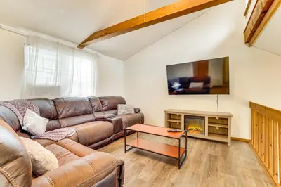 a living room with a couch and a fireplace at Ski, Swim and Hike! Family Home in Tobyhanna in Tobyhanna