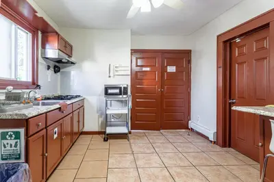 a kitchen with a sink and a stove top oven at 1 Bus Stop To NYC Room-Free Parking in Hillside