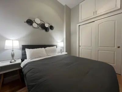 a bedroom with a large bed and a white door at The Marlow Midtown in New York