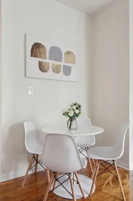 a white dining room with a white table and chairs at Gorgeous 2 Bedroom Apt in UES in New York