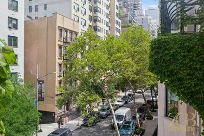a city street with cars parked on the street at Beautiful 1-Bedroom in the Upper East Side in New York
