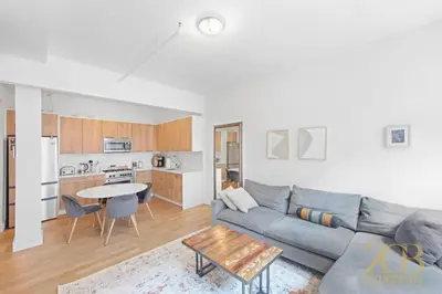 a living room with a couch and a table at Beautiful and Spacious 2 Bed 2 Bath Apt - Elevator in New York