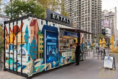 a woman standing in front of a food stand on a street at Modern 2BR Terrace WD & Elevator in NoMad in New York