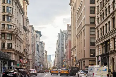 a busy city street filled with cars and buildings at Modern 2BR Terrace WD & Elevator in NoMad in New York