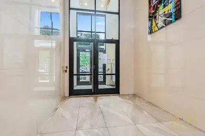 an empty room with a door and a window at Stylish 2-Bedroom Near Central Park - Laundry - Elevator in New York