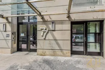 a building with a sign on the side of it at Stylish 2-Bedroom Near Central Park - Laundry - Elevator in New York